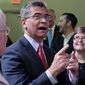 U.S. Department of Health and Human Services (HHS) Secretary Xavier Becerra, center, talks with with Oklahoma Medicaid advocates following a news conference Thursday, July 1, 2021, in Tulsa, Okla., as Oklahoma expands its Medicaid program. (AP Photo/Sue Ogrocki)