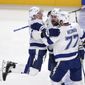Tampa Bay Lightning&#39;s Jan Rutta (44) celebrates his goal against the Montreal Canadiens with Ondrej Palat (18) and Victor Hedman (77) during the first period of Game 3 of the NHL hockey Stanley Cup Final, Friday, July 2, 2021, in Montreal. (Paul Chiasson/The Canadian Press via AP)
