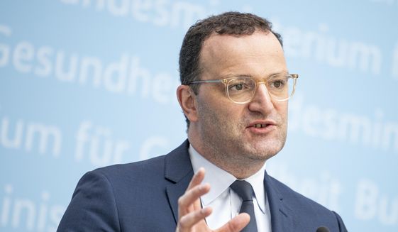 Jens Spahn (CDU), Germany&#x27;s Federal Minister of Health, comments at a press conference on the consequences of the STIKO recommendation to administer an mRNA vaccine after a first vaccination with Astrazeneca in Berlin, Germany, Friday, July 2, 2021. (Fabian Sommer/dpa via AP)