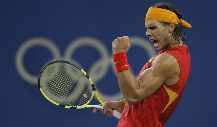 Rafael Nadal of Spain reacts to winning a point against Fernando Gonzalez of Chile during their Gold medal singles tennis match at the Beijing 2008 Olympics in Beijing, in this Sunday, Aug. 17, 2008, photo. Nadal will not be participating in the Tokyo Games. (AP Photo/Elise Amendola) **FILE**