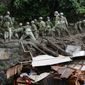 Rescuers continue a search operation at the site of a mudslide at Izusan in Atami, Shizuoka prefecture, southwest of Tokyo Monday, July 5, 2021. (Kyodo News via AP)