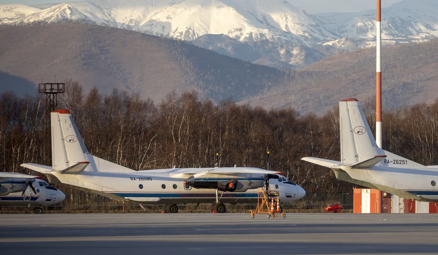 The Antonov An-26 with the same board number #RA-26085 as the missed plane is parked at Airport Elizovo outside Petropavlovsk-Kamchatsky, Russia, Tuesday, Nov. 17, 2020. Local officials say a plane with 28 people on board has gone missing in the Russian Far East region of Kamchatka. Emergency officials say the Antonov An-26 plane with 22 passengers and six crew members missed a scheduled communication while it was flying Tuesday from the city of Petropavlovsk-Kamchatsky to the village of Palana. (AP Photo/Marina Lystseva)