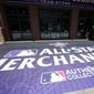 Shoppers head into Diamond Dry Goods, the team store for the Colorado Rockies at Coors Field, past a sidewalk sign advertising All-Star Game merchandise after a news conference Wednesday, July 7, 2021, to kick off All-Star week in Coors Field in Denver. (AP Photo/David Zalubowski) **FILE**