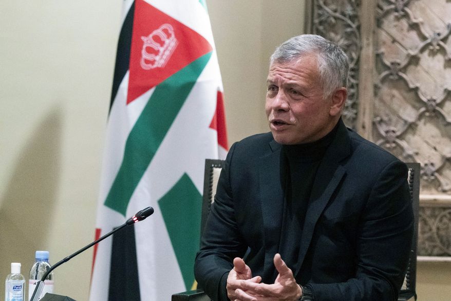 In this May 26, 2021, photo, Jordan's King Abdullah II speaks during a meeting with Secretary of State Antony Blinken at Bayt Al Urdon in Amman, Jordan. President Joe Biden will host Jordan's King Abdullah II at the White House on July 19, months after the detention of his half-brother amid a rare moment of palace intrigue for the close American ally. (AP Photo/Alex Brandon, Pool) **FILE**