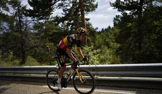 Belgium&#39;s Wout Van Aert rides the eleventh stage of the Tour de France cycling race over 198.9 kilometers (123.6 miles) with start in Sorgues and finish in Malaucene, France, Wednesday, July 7, 2021. (AP Photo/Daniel Cole)