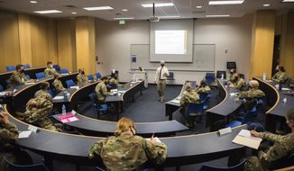 In this image provided by the U.S. Air force Academy, cadets start the school year with a mix of reduced class sizes and remote learning on Aug. 12, 2020, at the U.S. Air Force Academy in Colorado Springs, Colo. (Trevor Cokley/U.S. Air Force Academy via AP) ** FILE **