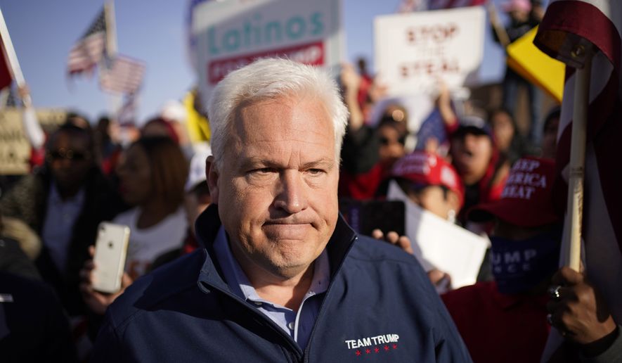 Matt Schlapp, chairman of the American Conservative Union, leaves after speaking at a news conference outside of the Clark County Election Department, Sunday, Nov. 8, 2020, in North Las Vegas. (AP Photo/John Locher)
