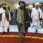 In this file photo taken on Thursday, March 18, 2021, Taliban co-founder Mullah Abdul Ghani Baradar, center, arrives with other members of the Taliban delegation for an international peace conference in Moscow, Russia. A delegation of the Taliban visited Moscow on Thursday, July 8, 2021 to offer assurances that their quick gains in Afghanistan don&#39;t threaten Russia or its allies in Central Asia. (AP Photo/Alexander Zemlianichenko, Pool, File)