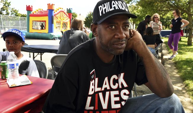 This Aug. 21, 2016 photo shows John Thompson, now a state representative, at a fundraiser at Central High School in St. Paul, Minn.  Thompson, who was ticketed for a driver’s license violation is alleging he was racially profiled. The citation says State Rep. John Thompson of St. Paul, who is Black, presented a Wisconsin license during a traffic stop in St. Paul Sunday, July 4, 2021 .  (Scott Takushi/Pioneer Press via AP)
