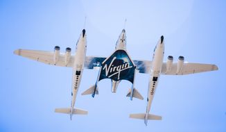 This Sept. 8, 2016 photo made available by Virgin Galactic shows the company&#39;s Spaceship Unity and Mothership Eve. After reaching nearly 50,000 feet (15,000 meters), Unity will be released and drop for a moment or two before its rocket motor ignites to send the craft on a steep climb toward space. (Virgin Galactic via AP)