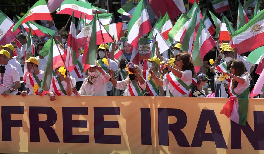 People attend a protest rally in Berlin, Germany, Saturday, July 10, 2021 as part of the &#39;Free Iran World Summit 2021&#39;. (AP Photo/Michael Sohn)