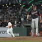 San Francisco Giants&#39; Darin Ruf, background left, rounds the bases after hitting a solo home against Washington Nationals relief pitcher Sam Clay (49) during the fifth inning of a baseball game Friday, July 9, 2021, in San Francisco. (AP Photo/Tony Avelar)