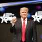 Former President Donald Trump raises his fist before speaking at the Conservative Political Action Conference (CPAC) Sunday, July 11, 2021, in Dallas. (AP Photo/LM Otero)