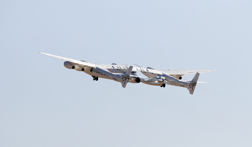 The rocket plane carrying Virgin Galactic founder Richard Branson and other crew members flies toward space from Spaceport America near Truth or Consequences, N.M., Sunday, July 11, 2021. (AP Photo/Andres Leighton)