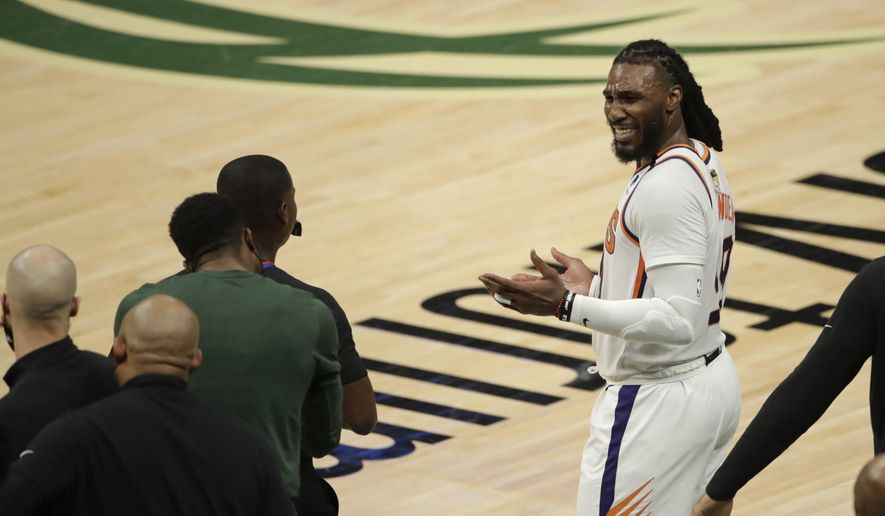 Phoenix Suns&#39; Jae Crowder reacts as he talks with members of the Milwaukee Bucks bench during the second half of Game 3 of basketball&#39;s NBA Finals, Sunday, July 11, 2021, in Milwaukee. (AP Photo/Aaron Gash) **FILE**