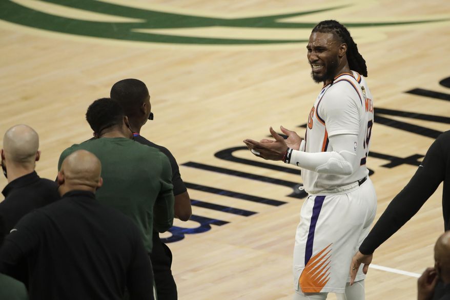 Phoenix Suns&#x27; Jae Crowder reacts as he talks with members of the Milwaukee Bucks bench during the second half of Game 3 of basketball&#x27;s NBA Finals, Sunday, July 11, 2021, in Milwaukee. (AP Photo/Aaron Gash) **FILE**