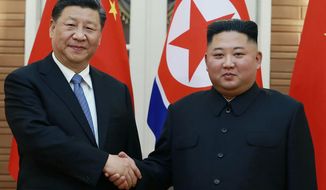 In this June 20, 2019, file photo provided by the North Korean government, North Korean leader Kim Jong Un, right, poses with Chinese President Xi Jinping for a photo at Kumsusan guest house in Pyongyang, North Korea. The North Korean and Chinese leaders expressed their desire Sunday, July 11, 2021 to further strengthen their ties as they exchanged messages marking the 60th anniversary of their countries’ defense treaty. In a message to Xi, Kim said it is “the fixed stand&amp;quot; of his government to “ceaselessly develop the friendly and cooperative relations&amp;quot; between the countries, the official Korean Central News Agency said. (Korean Central News Agency/Korea News Service via AP, File)