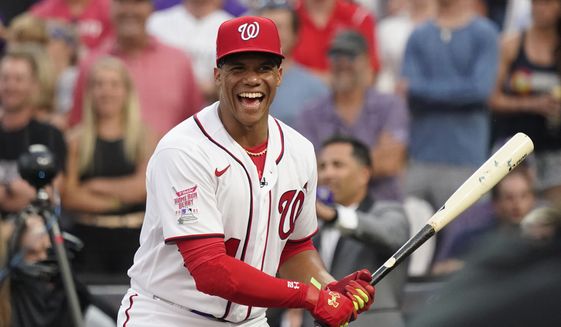 National League&#x27;s Juan Soto, of the Washington Nationals, laughs during the first round of the MLB All Star baseball Home Run Derby, Monday, July 12, 2021, in Denver. (AP Photo/Gabriel Christus) **FILE**