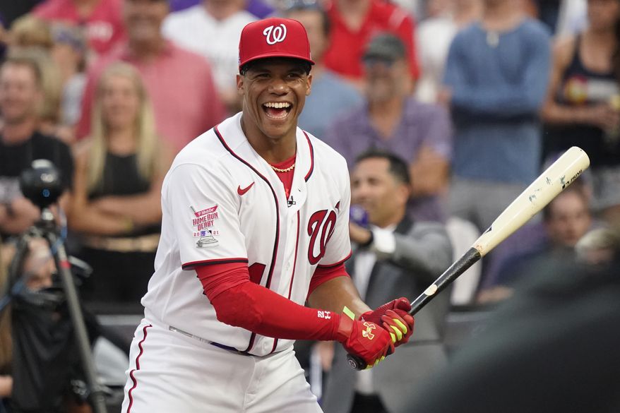 National League&#x27;s Juan Soto, of the Washington Nationals, laughs during the first round of the MLB All Star baseball Home Run Derby, Monday, July 12, 2021, in Denver. (AP Photo/Gabriel Christus) **FILE**