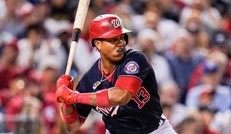 Washington Nationals&#39; Starlin Castro waits for a pitch from the Los Angeles Dodgers during the sixth inning of a baseball game, Friday, July 2, 2021, in Washington. (AP Photo/Julio Cortez)