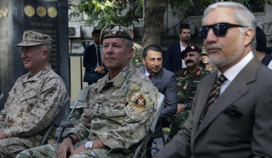 U.S. Army Gen. Scott Miller, the top U.S. commander in Afghanistan, center, Marine Gen. Frank McKenzie, the head of U.S. Central Command, left, and Abdullah Abdullah, head of Afghanistan&#39;s National Reconciliation Council, right, attend at a ceremony where Miller relinquished his command, at Resolute Support headquarters, in Kabul, Afghanistan, Monday, July 12, 2021. The United States is a step closer to ending a 20-year military presence that became known as its &amp;quot;forever war,&amp;quot; as Taliban insurgents continue to gain territory across the country. (AP Photo/Ahmad Seir)