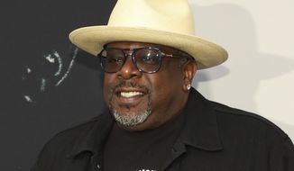 FILE - Cedric the Entertainer appears at the world premiere of the &amp;quot;Black Godfather&amp;quot; in Los Angeles on June 3, 2019. Cedric the Entertainer will host the Emmy Awards in September as the ceremony returns to a live telecast after last year’s pandemic-forced virtual event. There will be a limited audience of nominees and guests at the Microsoft Theatre for the Sept. 19 show airing on CBS. (Photo by Mark Von Holden/Invision/AP, File)