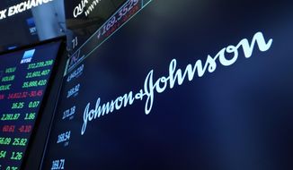 The Johnson &amp; Johnson logo appears above a trading post on the floor of the New York Stock Exchange, Monday, July 12, 2021, in this file photo. (AP Photo/Richard Drew)  **FILE**