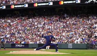 American League&#39;s starting pitcher Shohei Ohtani, of the Los Angeles Angeles, throws during the first inning of the MLB All-Star baseball game, Tuesday, July 13, 2021, in Denver. (AP Photo/Jack Dempsey)