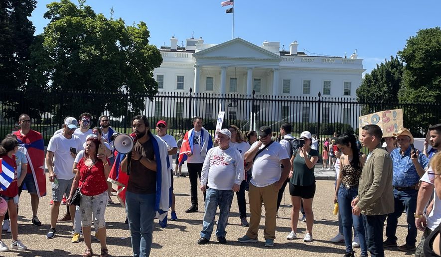 Emilio Fajardo, leader of MORE, a Cuban freedom group, urges the Biden administration to establish ties with Cuban protesters during a rally in front of the White House on July 13. (Jeff Mordock/The Washington Times)
