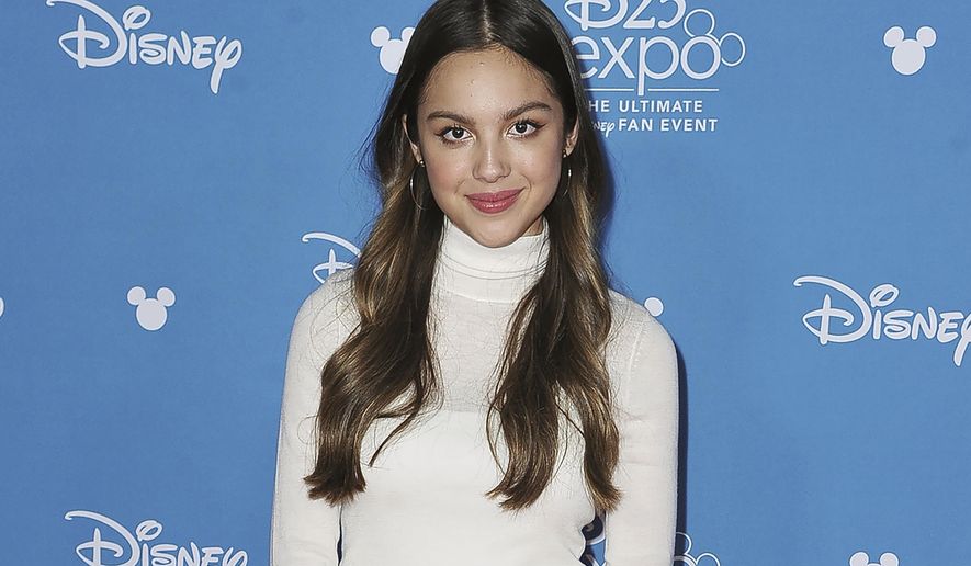 In this Aug. 23, 2019, photo, Olivia Rodrigo attends the Disney+ press line at the 2019 D23 Expo in Anaheim, Calif. President Joe Biden is putting a dose of star power behind the administration’s efforts to get young people vaccinated against COVID-19. The White House says the 18-year-old actress, singer and songwriter will meet Wednesday, July 14, 2021, with Biden and Dr. Anthony Fauci, the president’s chief medical adviser. Rodrigo will also record videos about the importance of young people getting vaccinated. (Photo by Richard Shotwell/Invision/AP) **FILE**