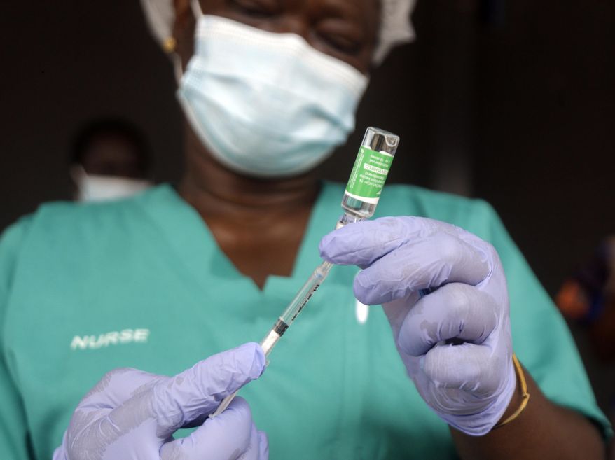 In this Friday, March 12, 2021, file photo, a nurse prepares one of the country&#x27;s first coronavirus vaccinations, using the AstraZeneca vaccine manufactured by the Serum Institute of India and provided through the global COVAX initiative, at Yaba Mainland hospital in Lagos, Nigeria. (AP Photo/Sunday Alamba, File)