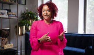 In this Tuesday, July 6, 2021, file photo, Nikole Hannah-Jones is interviewed at her home in the Brooklyn borough of New York. Hannah-Jones accepted a faculty position at Howard University amid controversy over whether she would be granted tenure at the University of North Carolina after critics questioned her credentials, specifically her Pulitzer Prize-winning work “The 1619 Project,” which traces the country’s history with slavery. Coates, a Howard graduate, is a journalist and best-selling author who also recently joined the university&#39;s faculty. (AP Photo/John Minchillo, File)
