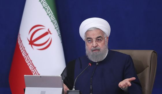 In this photo released by the official website of the office of the Iranian Presidency, President Hassan Rouhani speaks in a cabinet meeting in Tehran, Iran, Wednesday, July 14, 2021. The outgoing president on Wednesday warned his country could enrich uranium at weapons-grade levels of 90% if it chose, though it still wanted to save its tattered nuclear deal with world powers. (Iranian Presidency Office via AP)