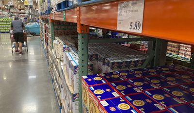 A shopper surveys the cereals in a Costco warehouse on Thursday, June 17, in Lone Tree, Colo. (AP Photo/David Zalubowski)