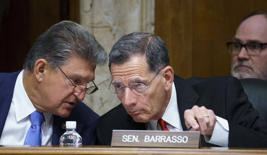 In this June 23, 2021, file photo, Sen. Joe Manchin, D-W.Va., chair of the Senate Energy and Natural Resources Committee holds a hearing with Ranking Member Sen. John Barrasso, R-Wyo., right, at the Capitol in Washington. (AP Photo/J. Scott Applewhite, File)