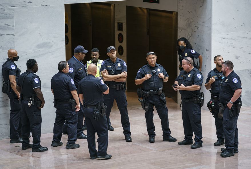 U.S. Capitol Police officers assemble in the Hart Senate Office Building, on Capitol Hill to prepare for a demonstration by voting rights advocates, in Washington, Thursday, July 15, 2021. (AP Photo/J. Scott Applewhite)