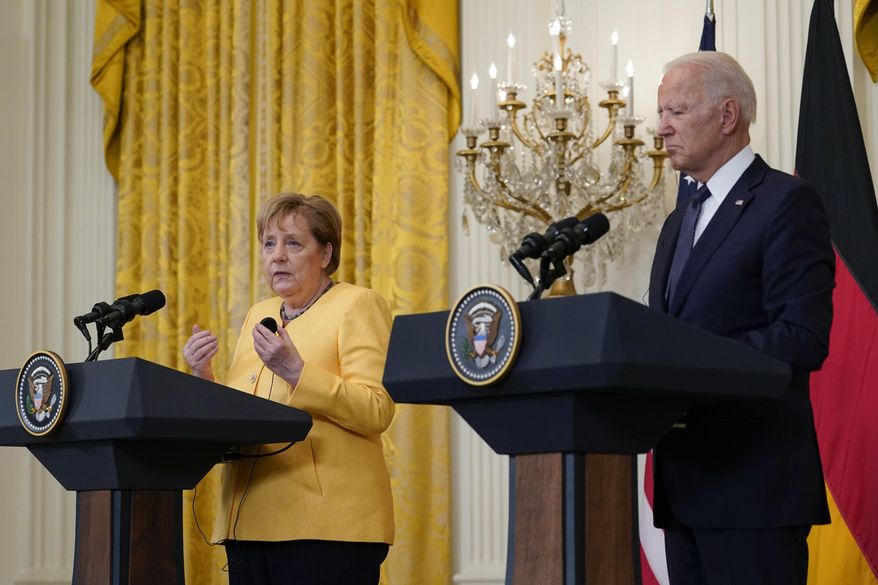 President Joe Biden and German Chancellor Angela Merkel speak during a news conference in the East Room of the White House in Washington, Thursday, July 15, 2021. (AP Photo/Susan Walsh)