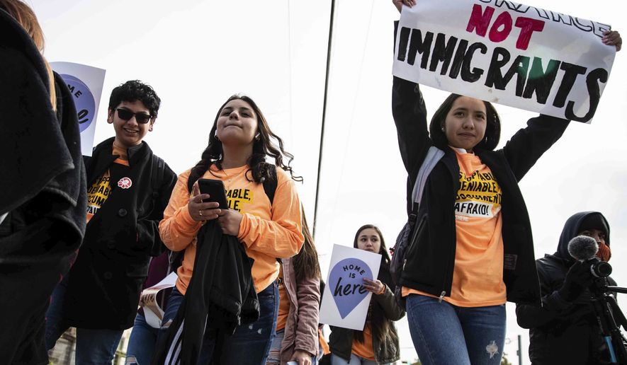 Immigrant youth and advocates rally to the office of Attorney General Ken Paxton on the day of the Supreme Court's hearing on DACA in Austin, Texas, in this July 2019 photo. (Lola Gomez/Austin American-Statesman via AP) **FILE**