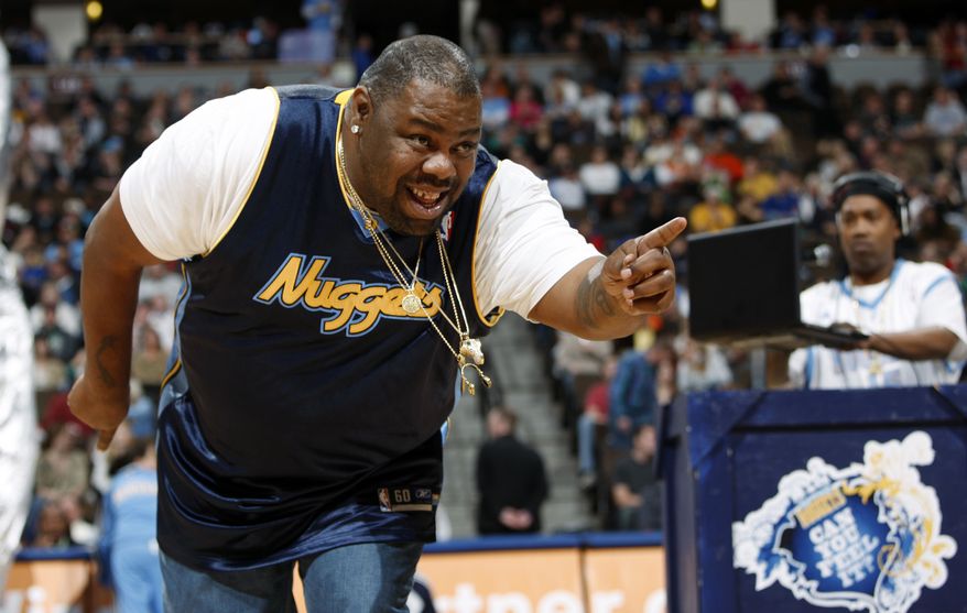 Biz Markie performs for fans during halftime of the Denver Nuggets' 105-99 victory over the Phoenix Suns in an NBA basketball game in Denver on Dec. 12, 2009. The hip-hop staple known for his beatboxing prowess, turntable mastery and the 1989 classic “Just a Friend,” has died. He was 57. Markie’s representative, Jenni Izumi, said in a statement that the rapper-DJ died peacefully Friday, July 16, 2021, with his wife by his side. No cause of death was released. (AP Photo/David Zalubowski) **FILE**