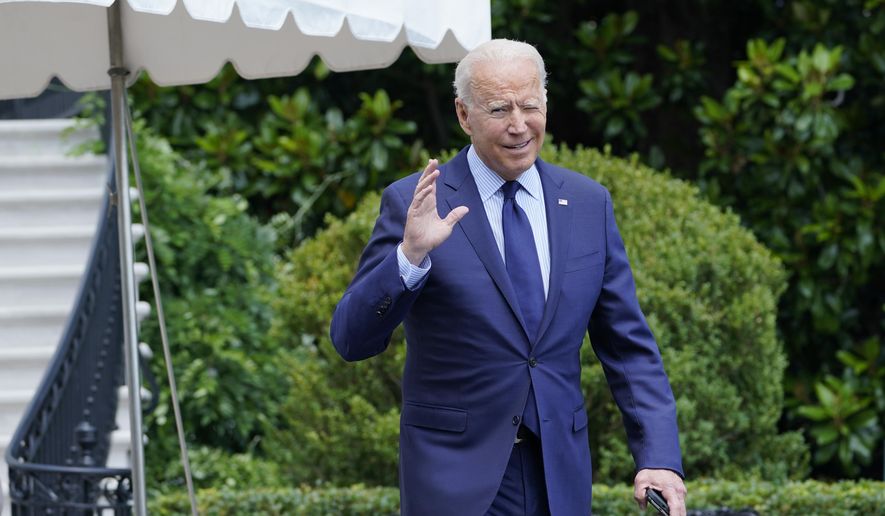 President Joe Biden tries to hear questions shouted by reporters as he heads to Marine One on the South Lawn of the White House in Washington, Friday, July 16, 2021, to spend the weekend at Camp David. (AP Photo/Susan Walsh)