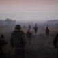 In this Dec. 23, 2009, file photo United States Marines from the 2nd Battalion 2nd Marines &quot;Warlords&quot; and Afghan National Army soldiers walk in formation during an operation in the Garmsir district of the volatile Helmand province, southern Afghanistan. (AP Photo/Kevin Frayer, File)