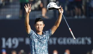 United States&#39; Collin Morikawa celebrates on the 18th green after winning the British Open Golf Championship at Royal St George&#39;s golf course Sandwich, England, Sunday, July 18, 2021. (AP Photo/Peter Morrison)