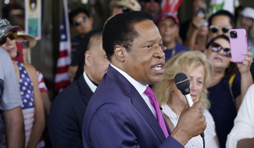 FILE - In this July 13, 2021, file photo, conservative radio talk show host Larry Elder speaks to supporters during a campaign stop in Norwalk, Calif. Elder was not on the list of candidates released Saturday in the recall election that could end the term of California Gov. Gavin Newsom. (AP Photo/Marcio Jose Sanchez, File)