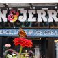 A Monarch butterfly lands on a flower outside the Ben &amp; Jerry&#x27;s Ice Cream shop, Tuesday, July 20, 2021, in Burlington, Vt. Ben &amp; Jerry&#x27;s said Monday it was going to stop selling its ice cream in the Israeli-occupied West Bank and contested east Jerusalem, saying the sales in the territories sought by the Palestinians are &quot;inconsistent with our values&quot;. (AP Photo/Charles Krupa)
