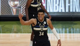 Milwaukee Bucks forward Giannis Antetokounmpo (34) reacts during the second half of Game 6 of basketball&#39;s NBA Finals against the Phoenix Suns in Milwaukee, Tuesday, July 20, 2021. (AP Photo/Paul Sancya)