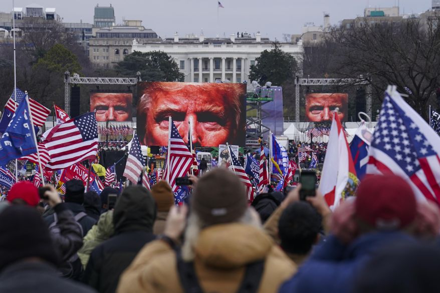 FILE - In this Jan. 6, 2021 file photo, Trump supporters participate in a rally in Washington. Months after Donald Trump’s supporters besieged the Capitol, the ex-president and his supporters are revising their account of that day. (AP Photo/John Minchillo, File)