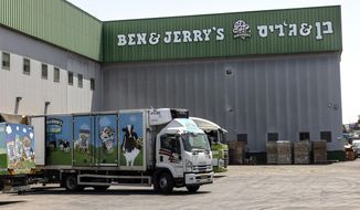 Trucks are parked at the Ben &amp; Jerry&#39;s ice-cream factory in the Be&#39;er Tuvia Industrial area in Israel in this Tuesday, July 20, 2021, in this file photo. (AP Photo/Tsafrir Abayov)  **FILE**