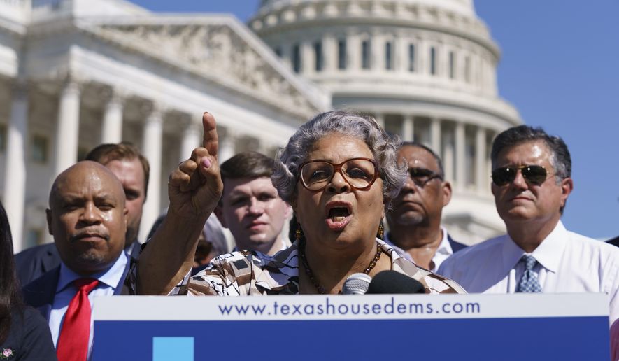 Texas State Rep. Senfronia Thompson, dean of the Texas House of Representatives, speaks as Democratic members of the Texas legislature hold a news conference at the Capitol in Washington. Texas Democrats are starting a second week of holing up in Washington to block new voting laws back home. More than 50 Democrats in the Texas House of Representatives had plans Monday to continue on a media blitz in the nation&#39;s capital and pressure Congress to act on federal voting rights. (AP Photo/J. Scott Applewhite, File)