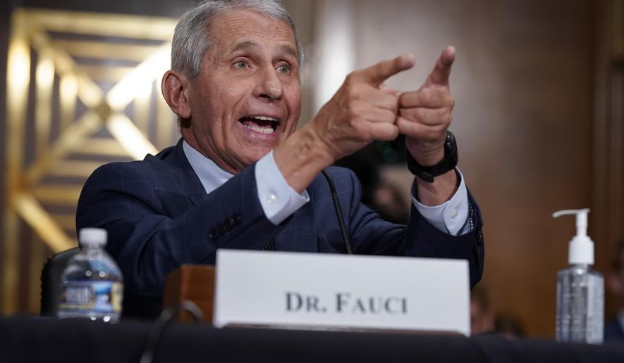 Top infectious disease expert Dr. Anthony Fauci responds to accusations by Sen. Rand Paul, R-Ky., as he testifies before the Senate Health, Education, Labor, and Pensions Committee about the origin of COVID-19, on Capitol Hill in Washington, Tuesday, July 20, 2021. Cases of COVID-19 have tripled over the past three weeks, and hospitalizations and deaths are rising among unvaccinated people. (AP Photo/J. Scott Applewhite, Pool)