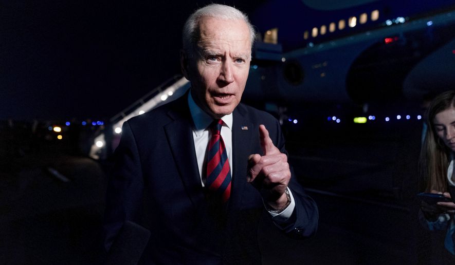 President Joe Biden talks to reporters before he boards Air Force One at Cincinnati/Northern Kentucky International Airport in Hebron, Ky., Wednesday, July 21, 2021, to travel back to Washington after speaking at a CNN town hall in Cincinnati. (AP Photo/Andrew Harnik)